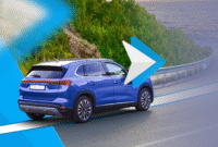 blue-suv-driving-on-a-coastal-road-with-a-large-android-auto-logo-overlayed-on-the-image