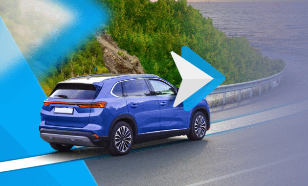 blue-suv-driving-on-a-coastal-road-with-a-large-android-auto-logo-overlayed-on-the-image